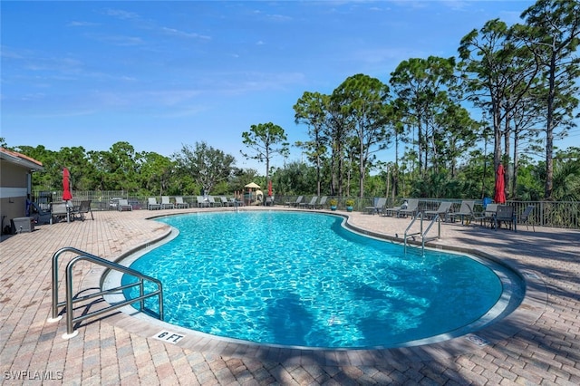 view of swimming pool featuring a patio