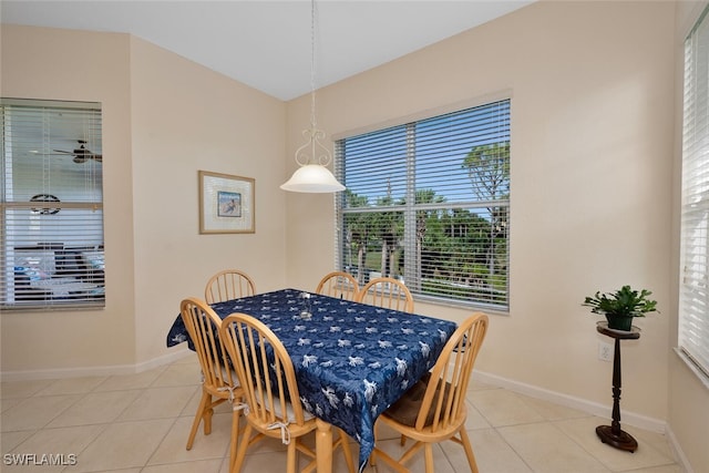 dining space featuring ceiling fan and light tile patterned floors