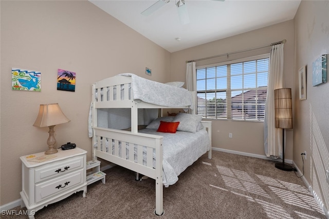 bedroom with ceiling fan and dark colored carpet