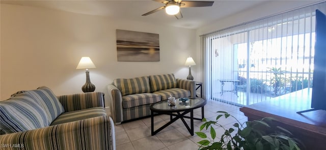 living room with ceiling fan and light tile patterned floors