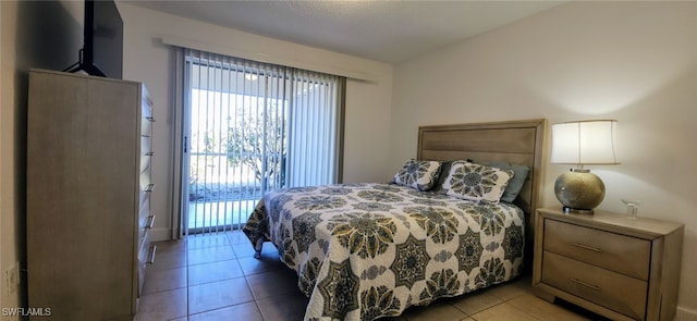 tiled bedroom featuring access to outside