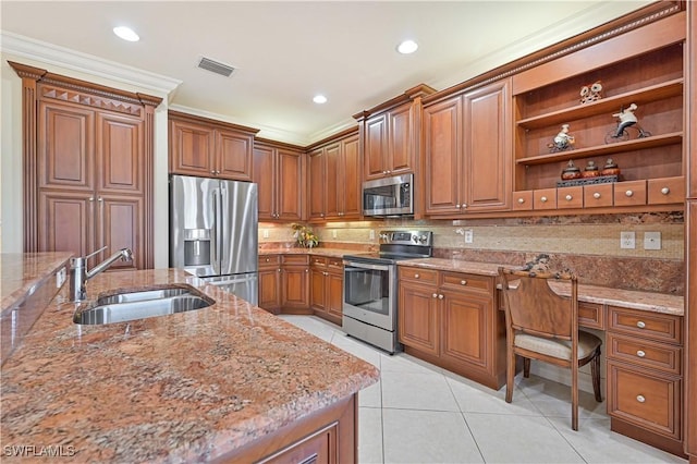 kitchen featuring light stone countertops, stainless steel appliances, light tile patterned floors, crown molding, and sink