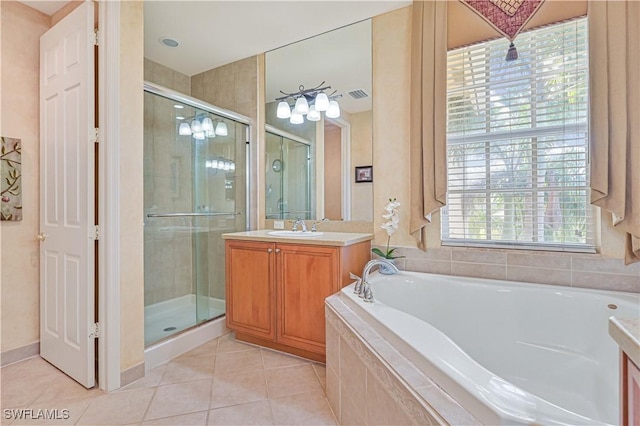 bathroom with independent shower and bath, tile patterned flooring, and vanity