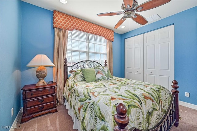 bedroom featuring ceiling fan, a closet, and carpet