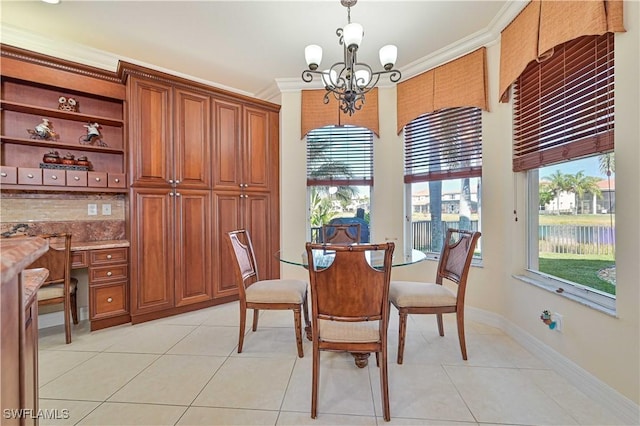 tiled dining room featuring a notable chandelier and ornamental molding