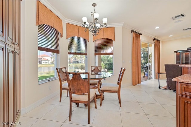 dining area featuring light tile patterned flooring, a chandelier, crown molding, and plenty of natural light