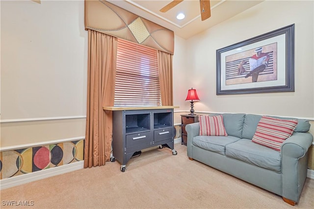 living room featuring vaulted ceiling, ceiling fan, and carpet