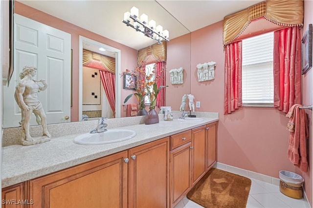 bathroom featuring tile patterned flooring and vanity