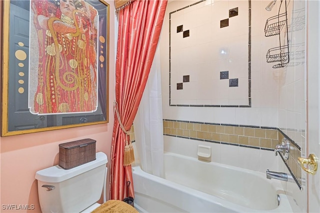 bathroom featuring shower / bath combination with curtain and toilet