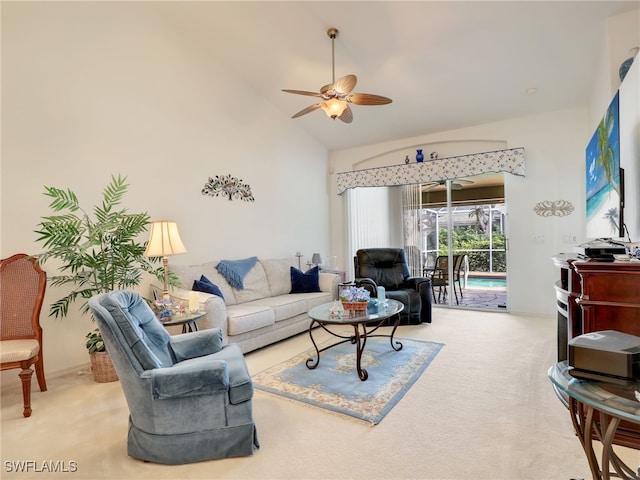 carpeted living room with ceiling fan and lofted ceiling