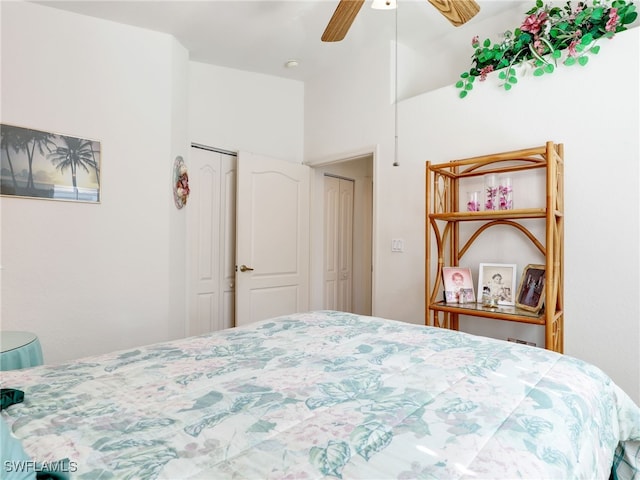 bedroom featuring ceiling fan and a closet