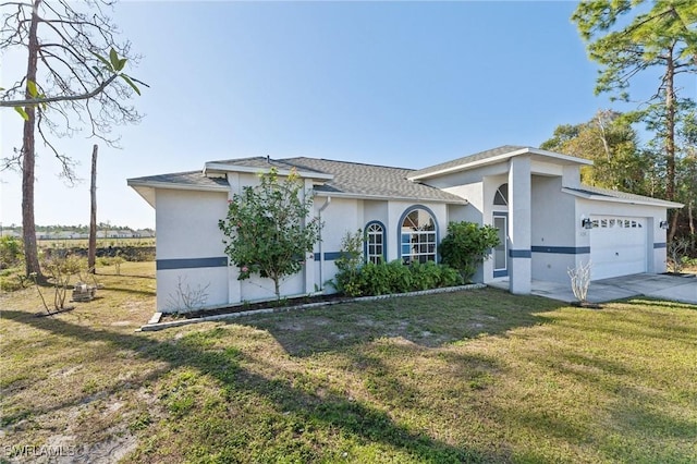 view of front facade with a front yard and a garage