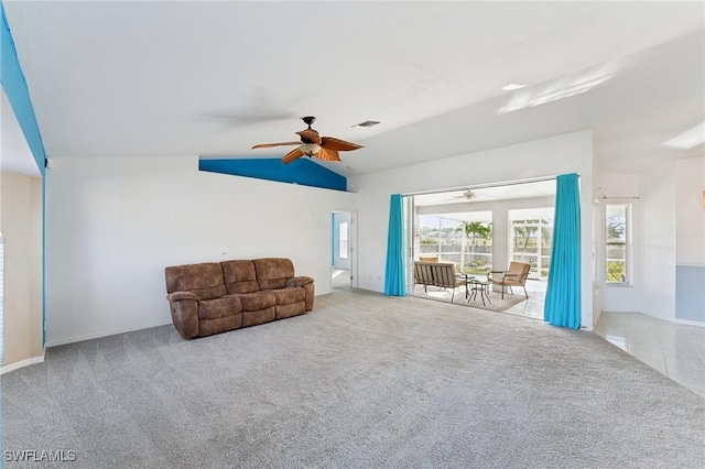 unfurnished room featuring ceiling fan, light carpet, and vaulted ceiling