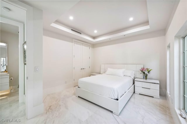 bedroom featuring a tray ceiling