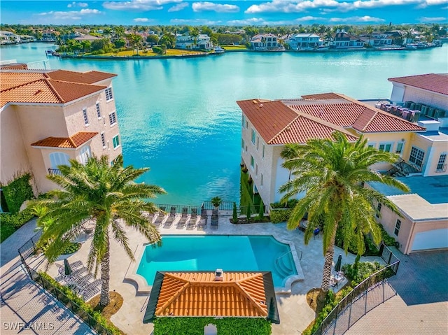 birds eye view of property with a water view