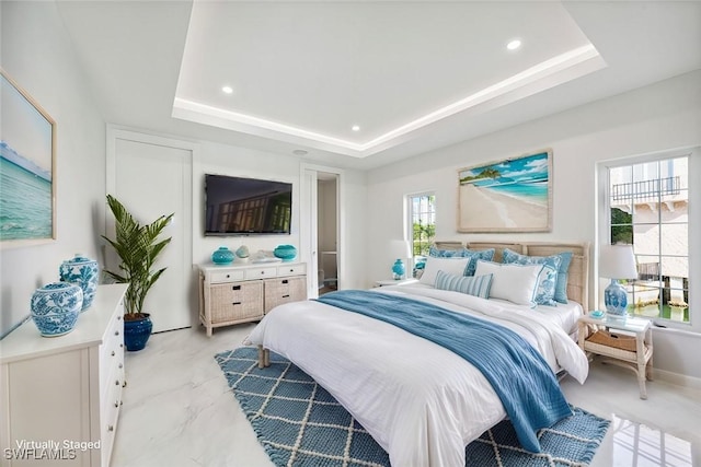 bedroom featuring a tray ceiling