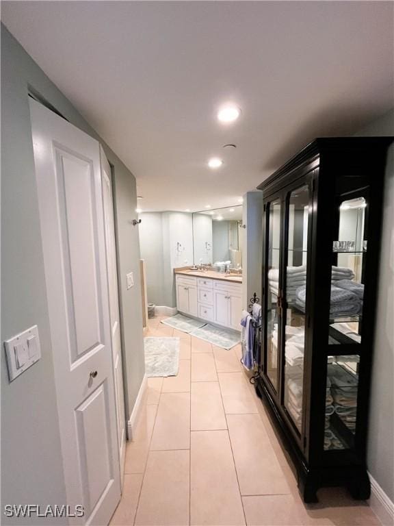 bathroom featuring toilet, tile patterned floors, and vanity