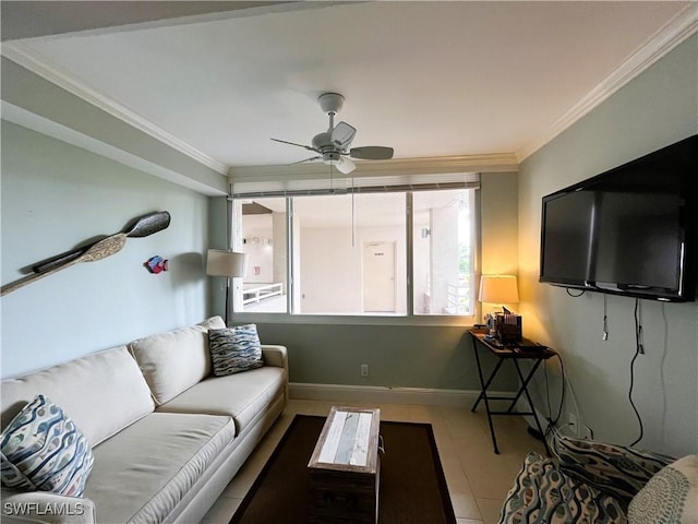 living room featuring ceiling fan, ornamental molding, and tile patterned flooring