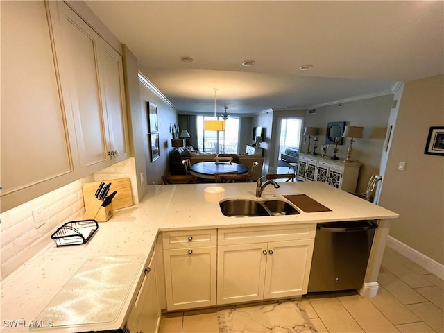 kitchen with kitchen peninsula, stainless steel dishwasher, hanging light fixtures, sink, and ornamental molding