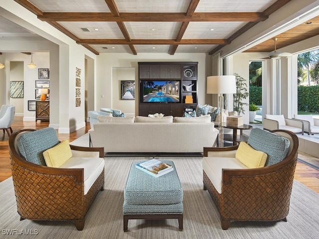 living room featuring beamed ceiling, wood-type flooring, and coffered ceiling