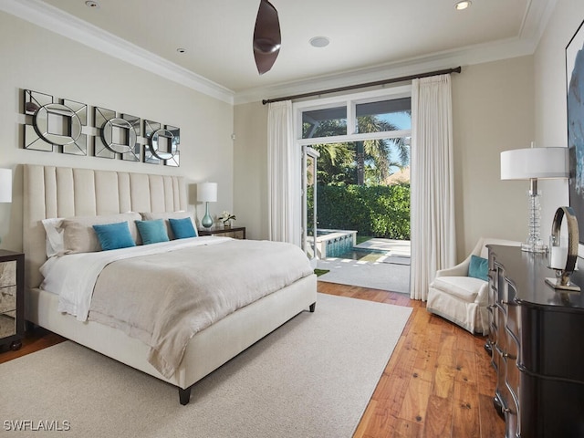 bedroom with hardwood / wood-style flooring, access to exterior, and crown molding