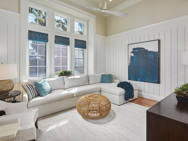 living room featuring hardwood / wood-style flooring and ceiling fan