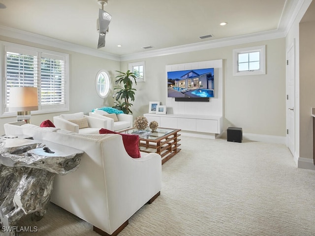 carpeted living room featuring a wealth of natural light and ornamental molding