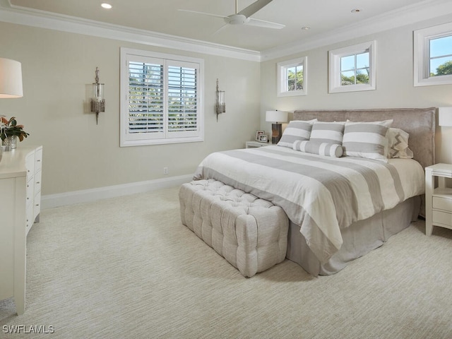 carpeted bedroom featuring ceiling fan and ornamental molding