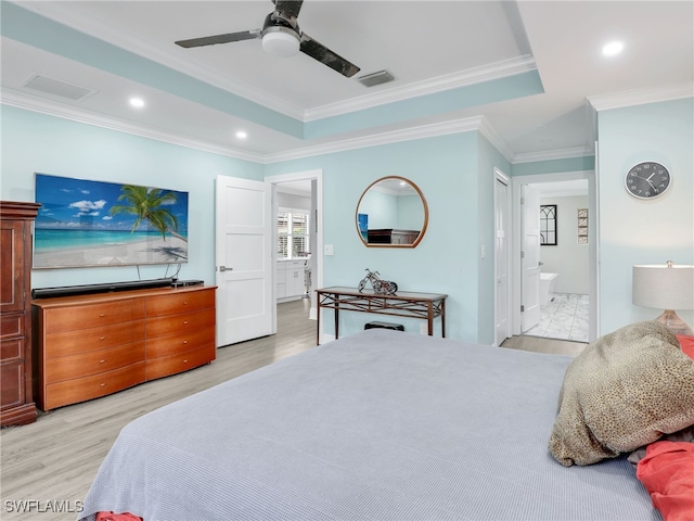 bedroom featuring ceiling fan, light wood-type flooring, ensuite bathroom, and ornamental molding