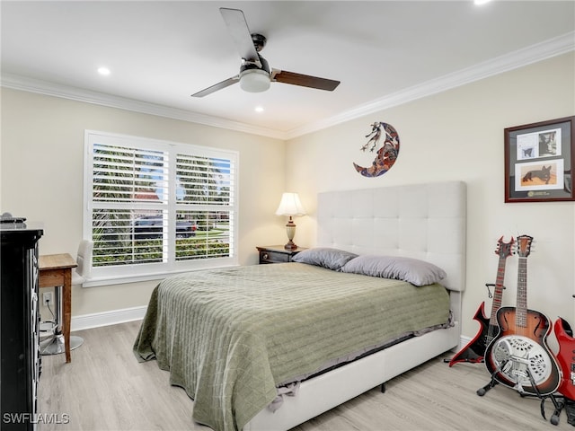 bedroom featuring ceiling fan, crown molding, and light wood-type flooring