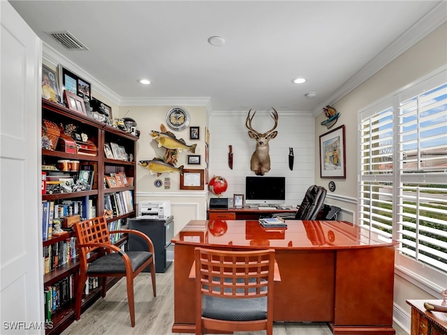 office area with crown molding and light hardwood / wood-style flooring