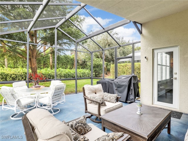 view of patio / terrace featuring a lanai and grilling area