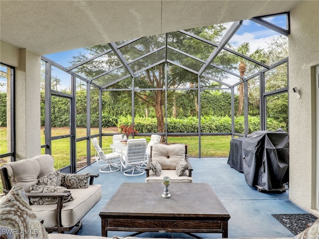 view of patio with a lanai, an outdoor living space, and grilling area