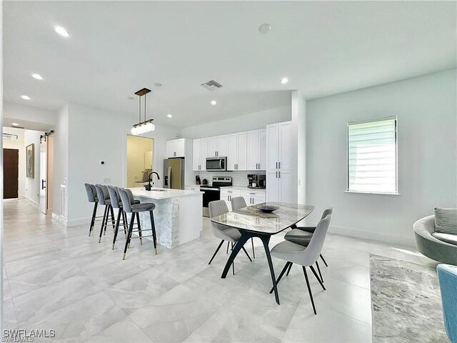 dining area featuring sink