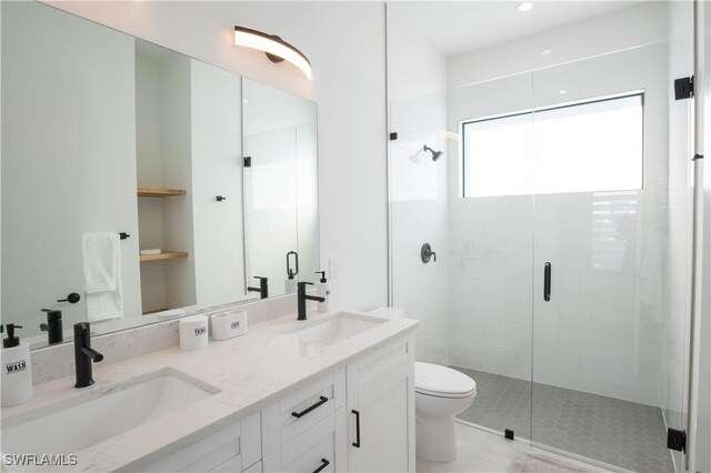 bathroom featuring walk in shower, tile patterned floors, vanity, and toilet