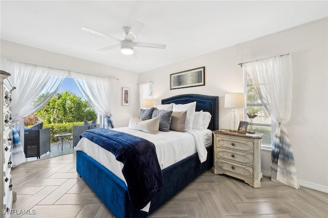 bedroom featuring ceiling fan, access to outside, and light parquet flooring