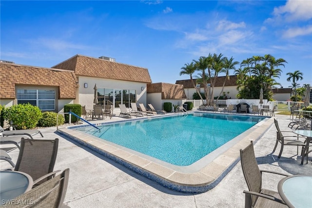 view of swimming pool featuring a patio area