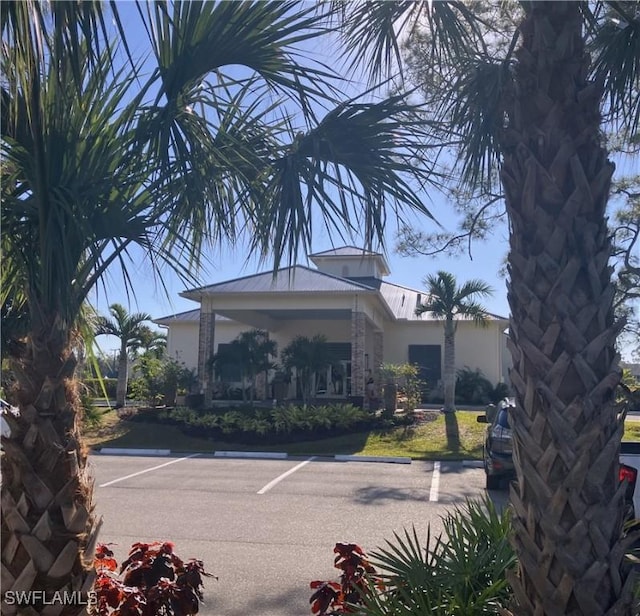 view of property with uncovered parking