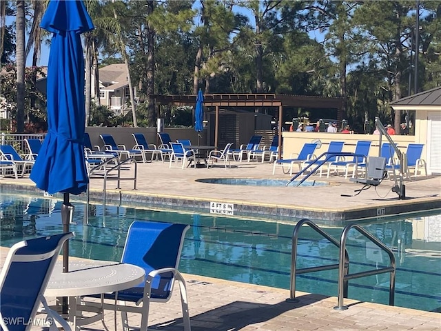 community pool featuring a patio area