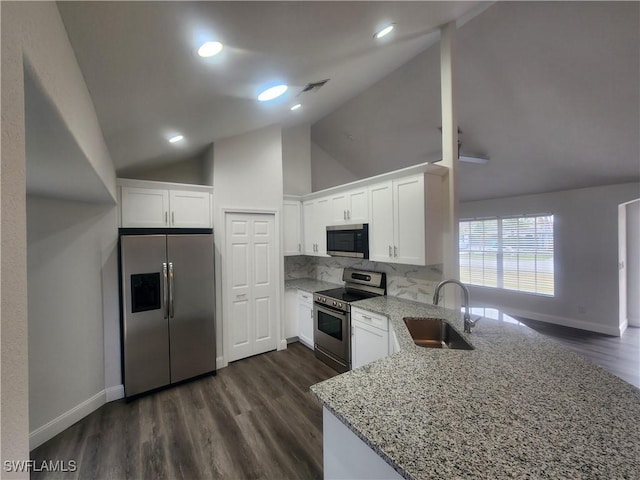 kitchen with stainless steel appliances, white cabinetry, and sink