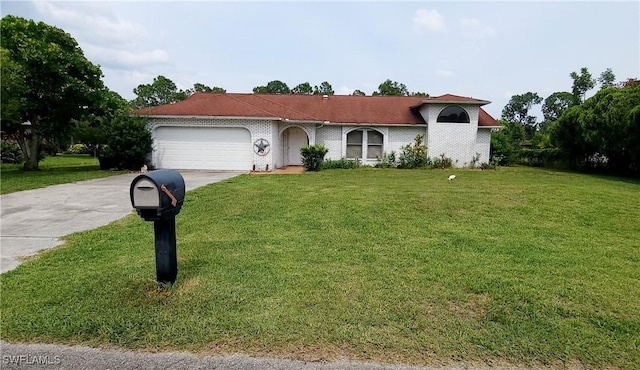 view of front of property with a front lawn and a garage