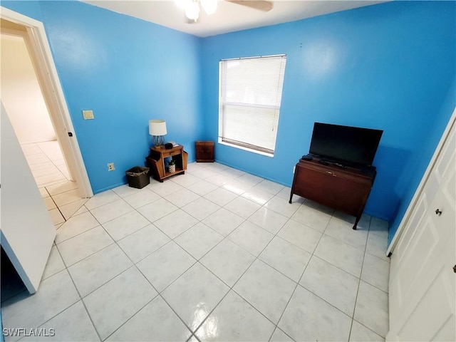 miscellaneous room with ceiling fan and light tile patterned flooring