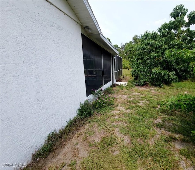 view of yard featuring a sunroom