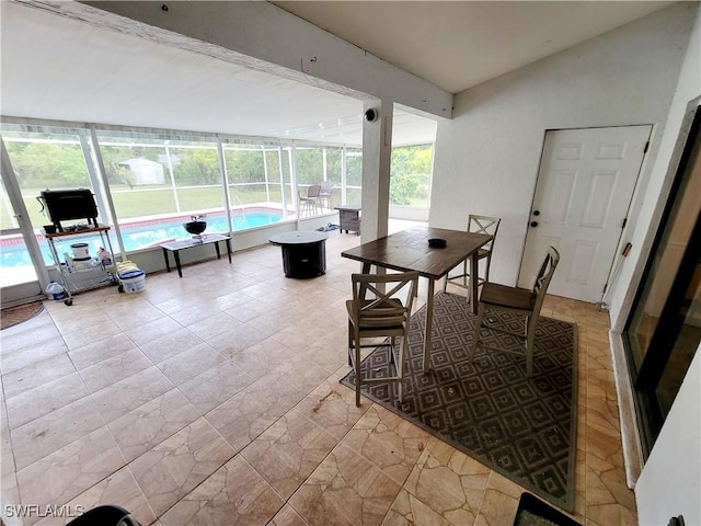 interior space featuring an indoor pool and a lanai