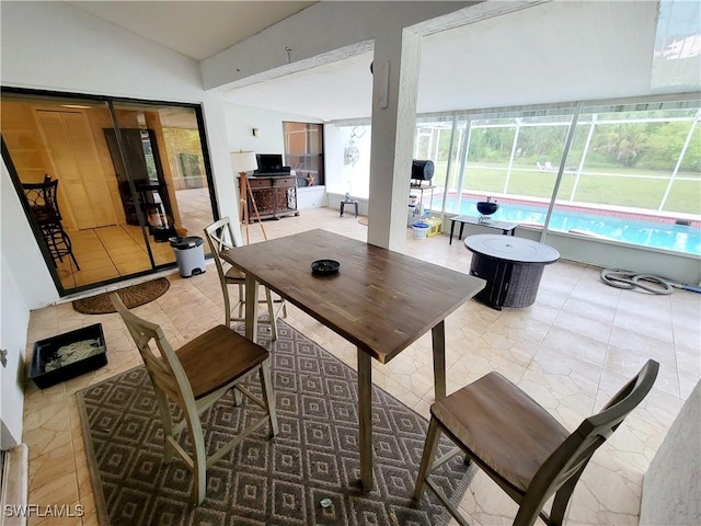 dining space with vaulted ceiling