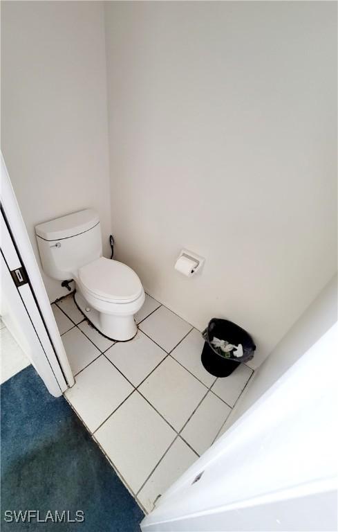 bathroom with tile patterned floors and toilet