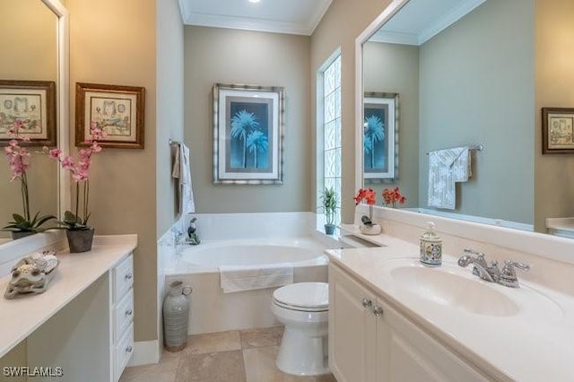 bathroom featuring vanity, tile patterned floors, crown molding, a washtub, and toilet