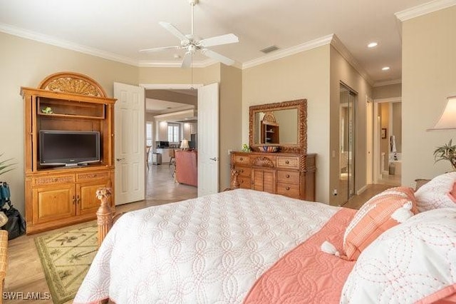 bedroom featuring ceiling fan, ornamental molding, and ensuite bathroom