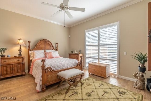 bedroom featuring ceiling fan, ornamental molding, and light hardwood / wood-style flooring