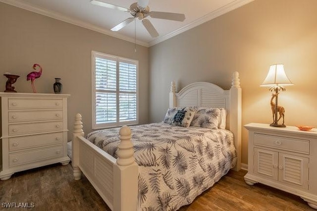 bedroom featuring ceiling fan, dark hardwood / wood-style floors, and crown molding